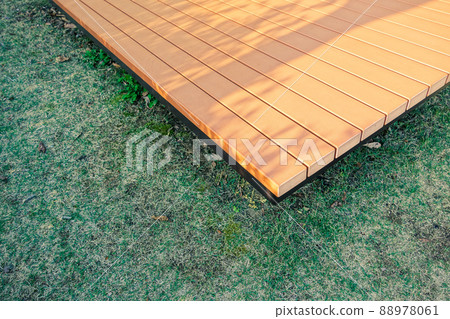 Park bench lawn dusk sunbeams Park bench lawn dusk sunbeams 88978061
