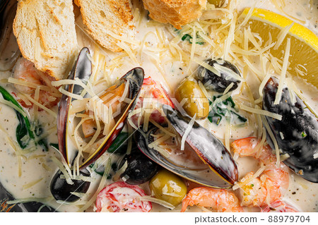 Closeup on seafood saute with wheat bread 88979704