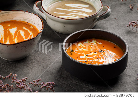 Bowls of different cream soup  88979705