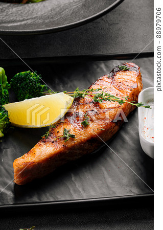 Grilled salmon fillet steak with broccoli 88979706