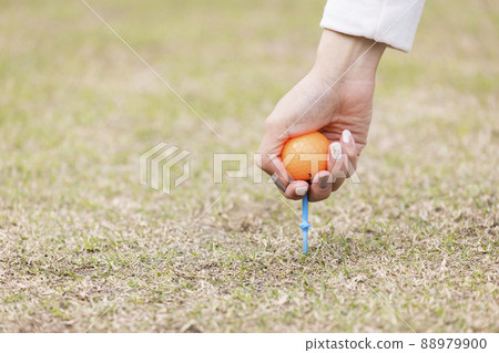 Woman preparing for a tee shot Woman preparing for a tee shot 88979900