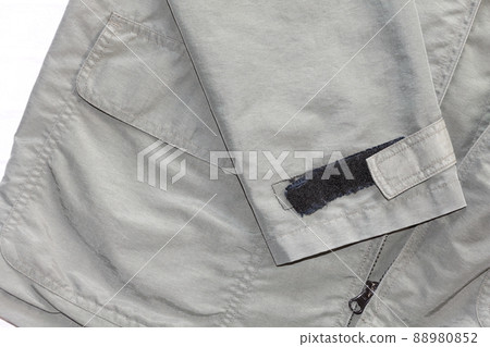 A coat with tattered velcro A coat with tattered velcro 88980852