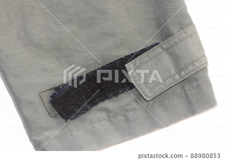 A coat with tattered velcro A coat with tattered velcro 88980853