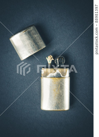 Old vintage lighter on a dark background Old vintage lighter on a dark background 88981397