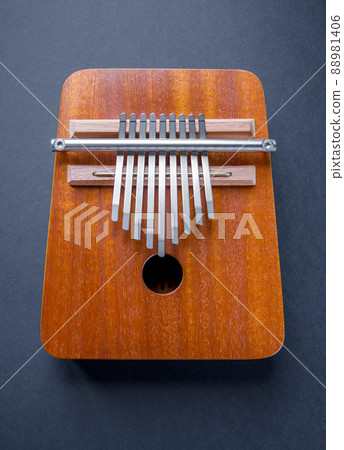 Traditional wooden kalimba isolated on black Traditional wooden kalimba isolated on black 88981406