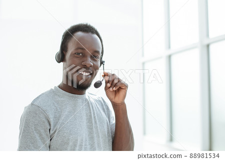 close up. a handsome young man with a headset. 88981534