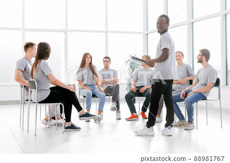 business coach and a group of young people at a seminar in the conference room 88981767