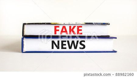 Fake news symbol. Books with concept words Fake news on beautiful white background. Business media and fake news concept. Copy space. 88982160