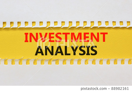 Investment analysis symbol. Yellow and white paper with concept words Investment analysis on beautiful white background. Business investment analysis concept. Copy space. 88982161