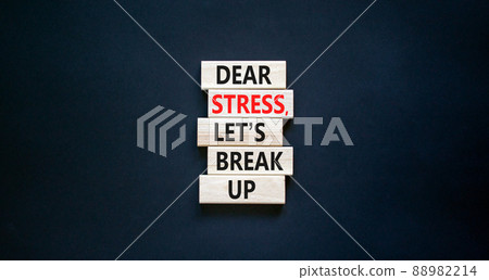 Stress break up symbol. Concept words Dear stress let is break up on wooden blocks. Beautiful black table black background. Business motivational stress break up concept. Copy space. 88982214