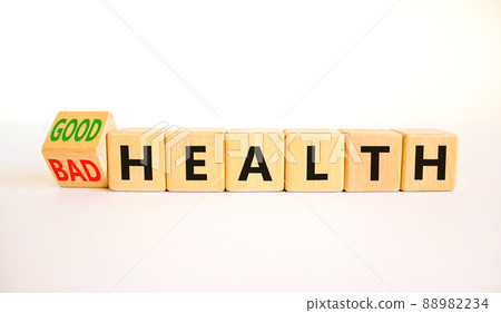 Good or bad health symbol. Turned wooden cubes and changed concept words Bad health to Good health. Beautiful white table white background, copy space. Medical good or bad health concept. Good or bad health symbol. Turned wooden cubes and changed concept words Bad health to Good health. Beautiful white table white background, copy space. Medical good or bad health concept. 88982234
