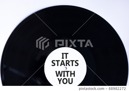 It starts with you symbol. Concept words It starts with you on retro black vinyl disc. Beautiful white background, copy space. Business and It starts with you concept. 88982272