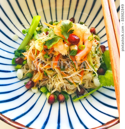 Noodles with vegetables in Asian style in Japanese dishes. Vegetarian food, diet. 88982849