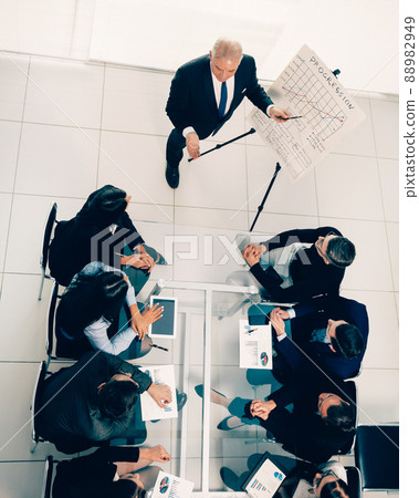 top view. boss at a meeting with the business team top view. boss at a meeting with the business team 88982949