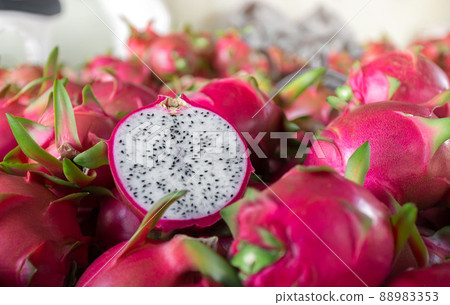 Dragon fruit that has been cut in half for product display. dragon fruit which are beautifully arranged in baskets to prepare for export sale. 88983353
