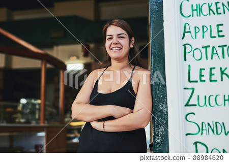 Believe me, youll be back for more. Cropped shot of a young woman working in her bakery. 88984620