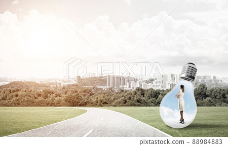 Businesswoman inside light bulb 88984883