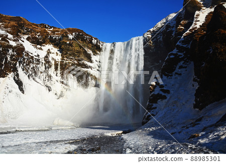 Icelandic waterfall, snowy landscape of Skogafoss 88985301