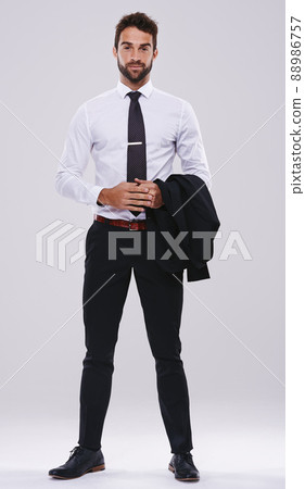 The business world is my playground. Studio shot of a handsome and well-dressed young man. 88986757