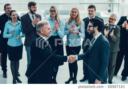 happy business partners shaking hands. the concept of cooperati happy business partners shaking hands. the concept of cooperati 88987181
