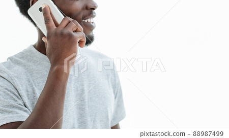 handsome guy with smartphone looking at copy space. handsome guy with smartphone looking at copy space. 88987499