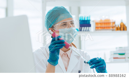 female laboratory assistant conducts blood tests in the laboratory female laboratory assistant conducts blood tests in the laboratory 88988162