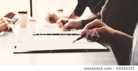 close up. a group of employees works with business documents. 88988345