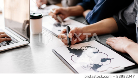 close up. business team checking the product distribution infrastructure. Elements of this image furnished by NASA 88988347