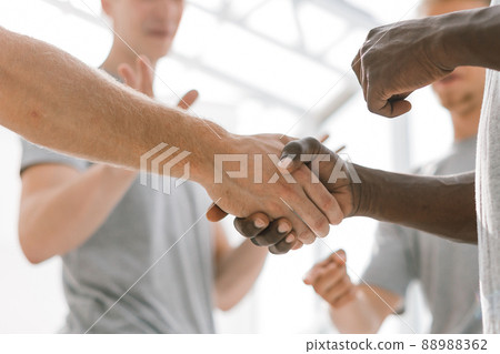 close up. two young like-minded people shaking hands. close up. two young like-minded people shaking hands. 88988362