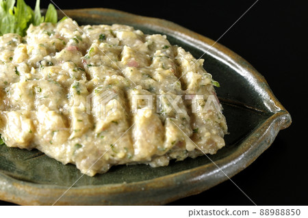 Photographed the namero of a local dish made by hitting a lot of horse mackerel on a black background Photographed the namero of a local dish made by hitting a lot of horse mackerel on a black background 88988850