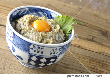 Namero bowl of horse mackerel topped with egg yolk Namero bowl of horse mackerel topped with egg yolk 88989198