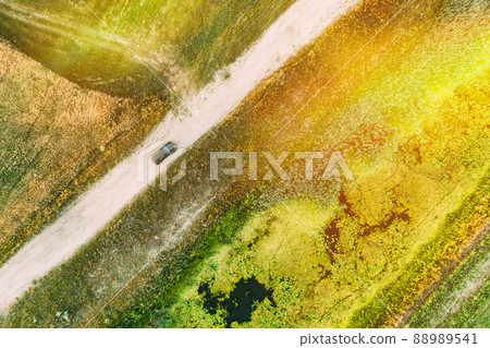 Aerial View Of Car SUV Parked Near Countryside Road, Summer Field Rural Landscape near bog marsh swamp 88989541