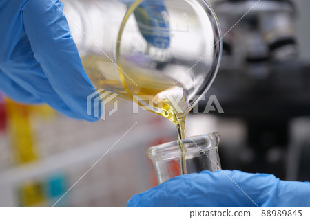 Chemical laboratory research and liquid oil processing closeup Chemical laboratory research and liquid oil processing closeup 88989845