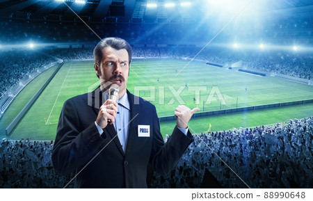 Pressman at football arena, before game having online broadcast. Sport news, information, championship. leage Pressman at football arena, before game having online broadcast. Sport news, information, championship. leage 88990648