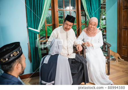 family forgiving each other and shake their hand on idul fitri family forgiving each other and shake their hand on idul fitri 88994380