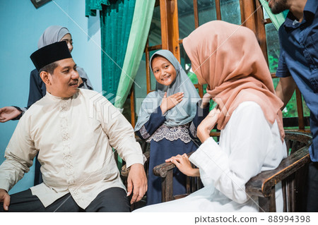 a family joy during idul fitri celebration 88994398