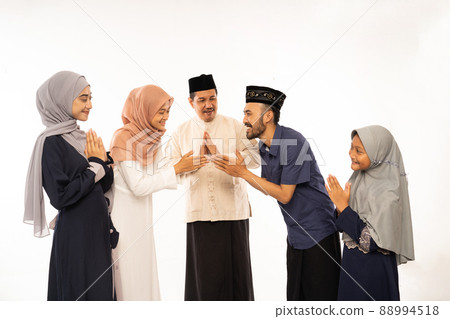 muslim family embracing during family eid mubarak celebration 88994518