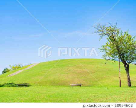 Suburban residential area blue sky and fresh green hill Suburban residential area blue sky and fresh green hill 88994602