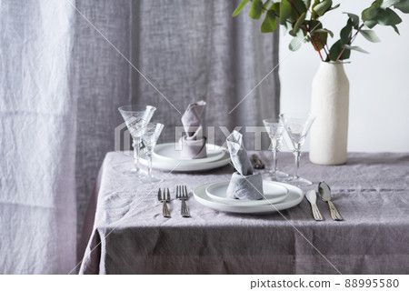 Home decor concept with linen tablecloth and linen napkin Home decor concept with linen tablecloth and linen napkin 88995580