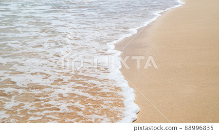 Wet shiny coastal sand and sea water, abstract background texture 88996835