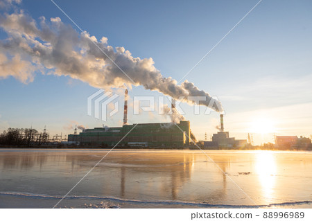 Air pollution from a natural gas and coal power plant. Emissions of harmful substances into the atmosphere. Traditional hydrocarbon energy. Electricity and heat production. Ecological concept. 88996989