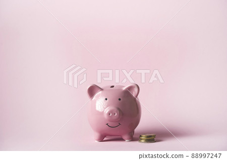 Cute pink piggy bank, close up view. 88997247