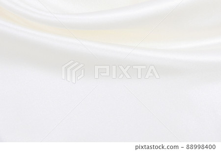 Smooth elegant white silk or satin luxury cloth texture as wedding background. Luxurious background design 88998400