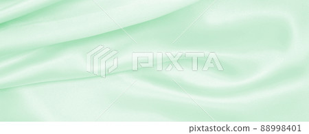 Smooth elegant green silk or satin luxury cloth texture as abstract background. Luxurious background design Smooth elegant green silk or satin luxury cloth texture as abstract background. Luxurious background design 88998401