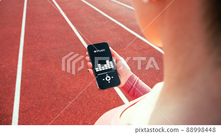 Fitness music. Listening music composition. Lifestyle workout exercise woman training. Fitness, sport, lifestyle concept. Fitness music. Listening music composition. Lifestyle workout exercise woman training. Fitness, sport, lifestyle concept. 88998448