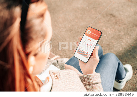 Pregnancy health app. Pregnant woman holding smartphone. Mobile pregnancy online maternity application. Concept of pregnancy, maternity, expectation for baby birth. Pregnancy health app. Pregnant woman holding smartphone. Mobile pregnancy online maternity application. Concept of pregnancy, maternity, expectation for baby birth. 88998449