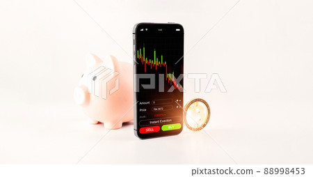 Crypto currency trading. Pink piggy bank, gold crypto currency BTC bitcoin, bitcoin wallet mobile phone application on white background. Save virtual money concept. Crypto currency trading. Pink piggy bank, gold crypto currency BTC bitcoin, bitcoin wallet mobile phone application on white background. Save virtual money concept. 88998453