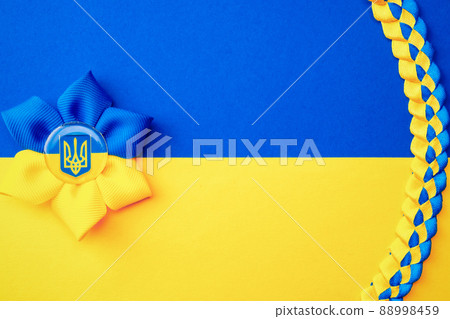 Ukraine flag symbol background. Ukrainian flower trident symbol isolated on yellow blue flag banner. Support Ukraine concept. 88998459