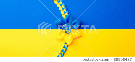 Ukraine symbol yellow background. Ukrainian flower trident symbol isolated on yellow blue flag. Solidarity Ukraine concept. 88998487