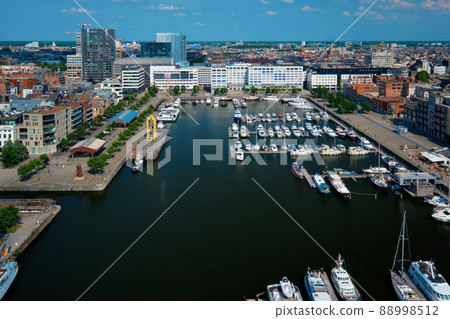 Yachts at the oldest harbor district Eilandje of Antwerp city - waterfront marina promenade, Belgium 88998512